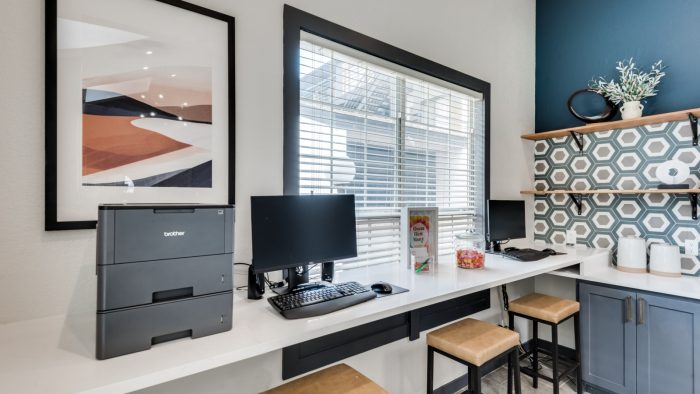 a home office with a desk and two chairs at The Grant Valley Ranch