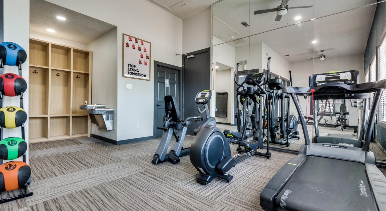 a gym room with treadmills and exercise equipment at The Grant Valley Ranch